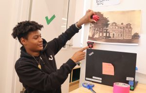 HS student demonstrates how coding causes a tool to work
