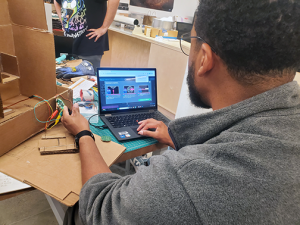 Educator works on coding project in Makerspace
