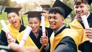 small group of high school grads in caps and gowns
