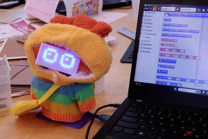 carebot example by a laptop with coding