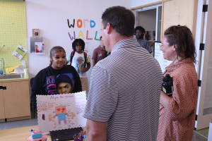 students present their projects to visitors