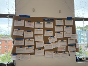 notes taped to wall during hackathon